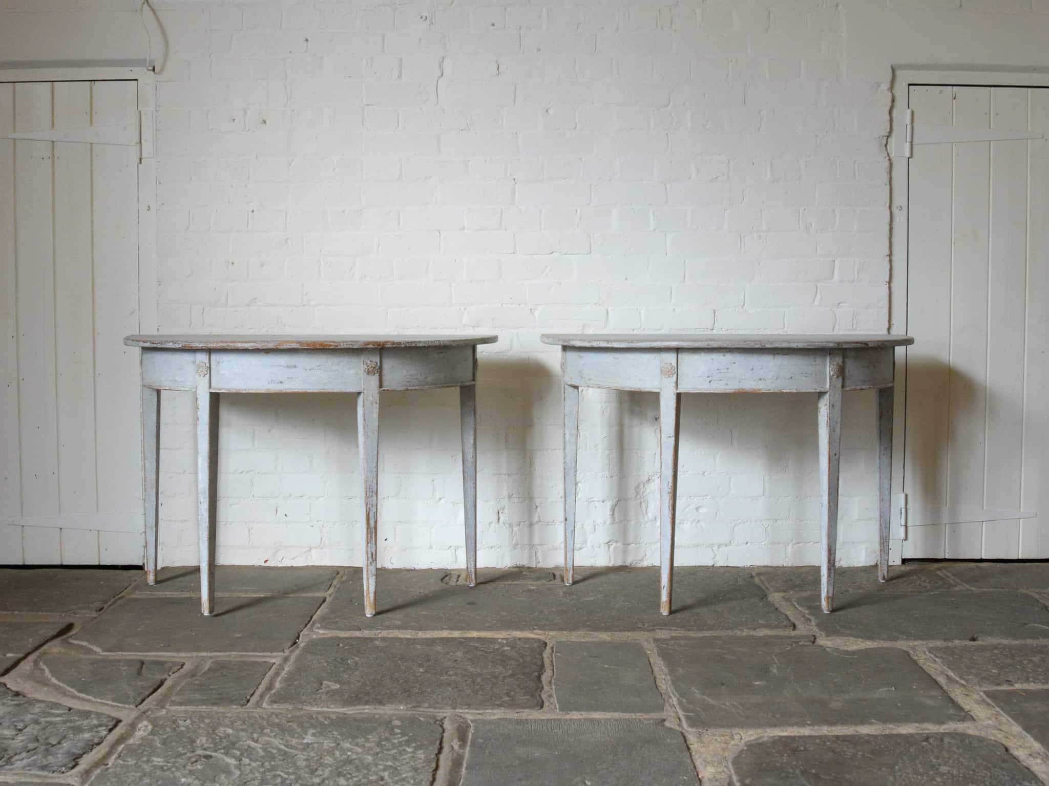 Pair of Swedish demi-lune tables.