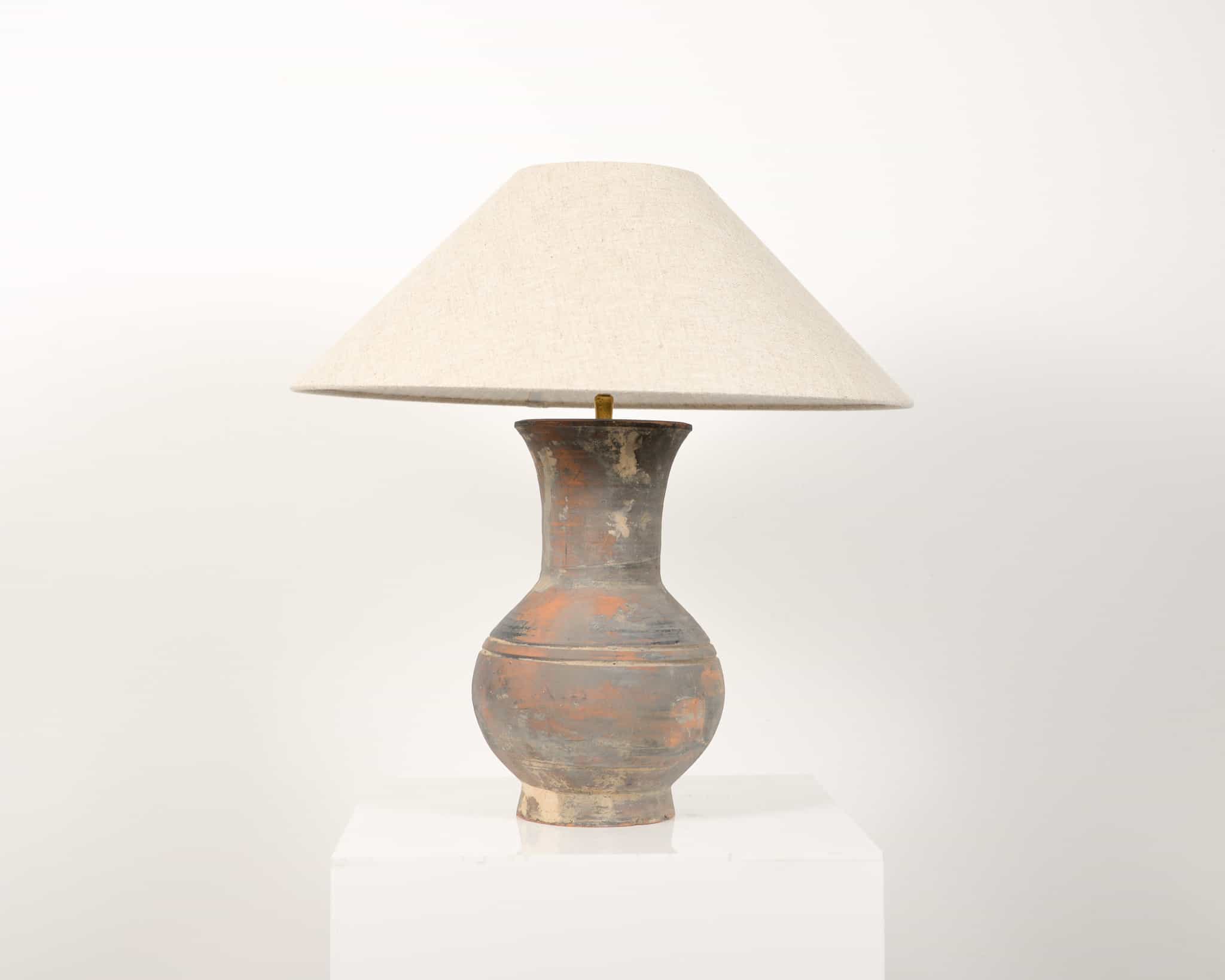A late 18th century terracotta vase table lamp