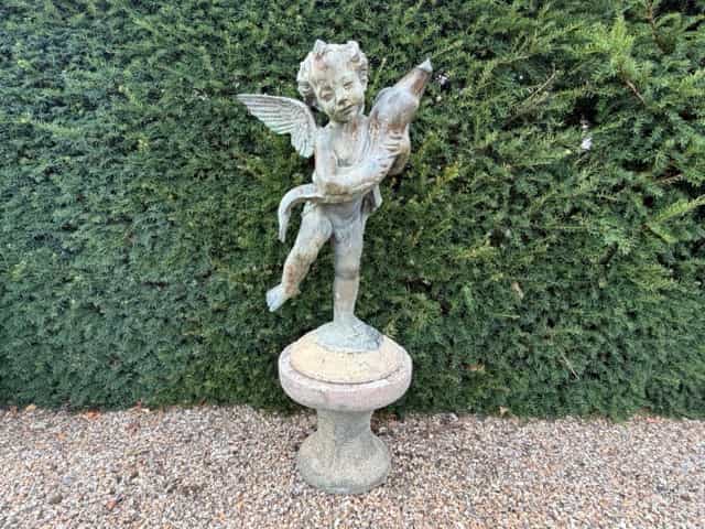 Bronze-resin garden statue putti