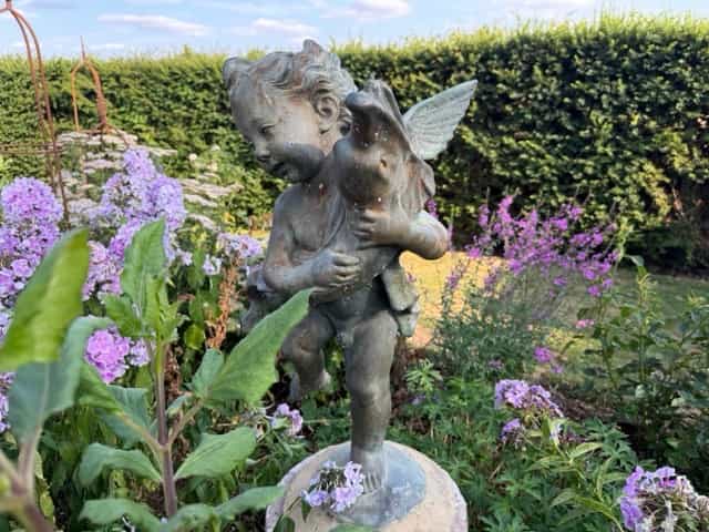 Bronze-resin garden statue putti