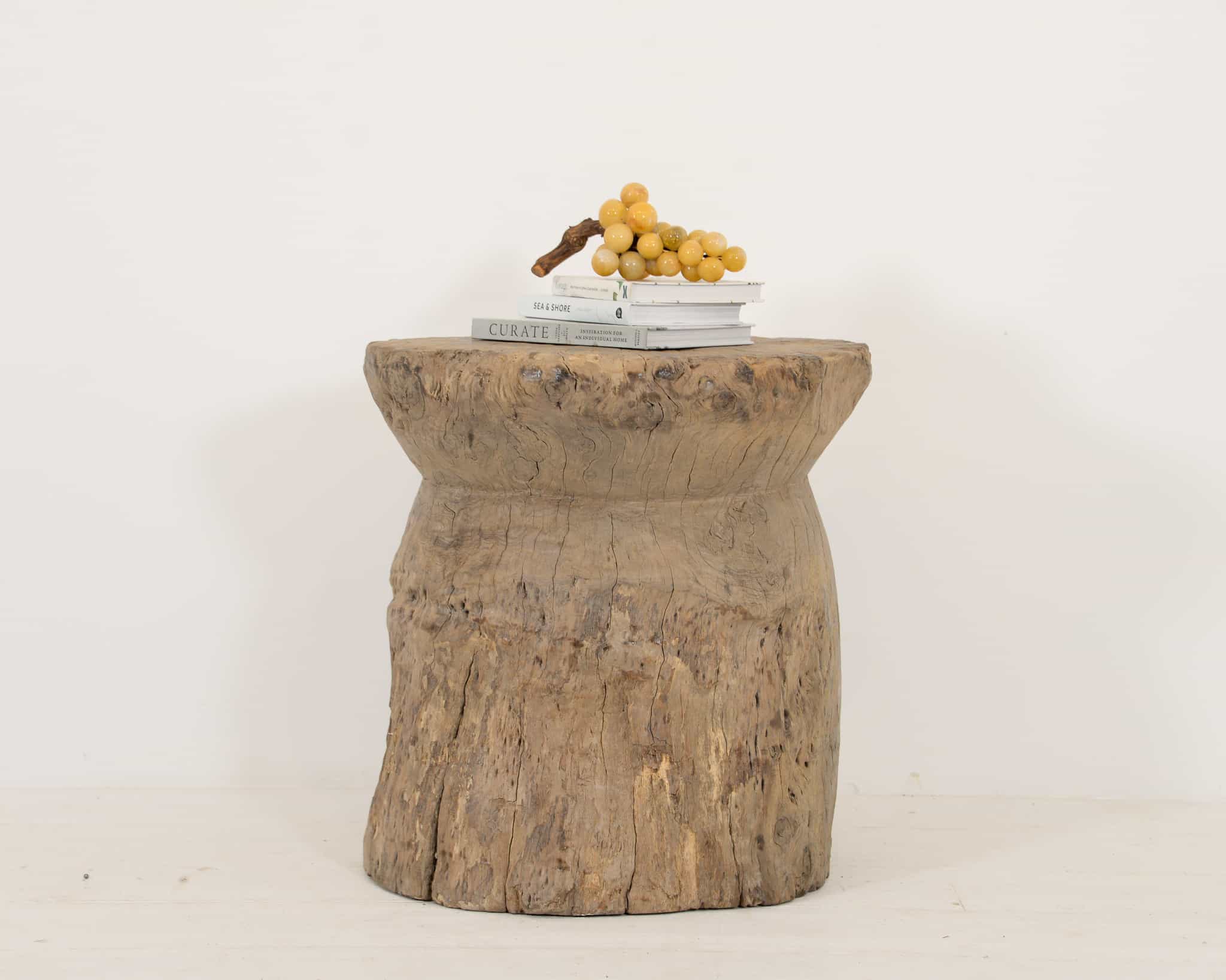 Side table made out of a single piece of Indian wood
