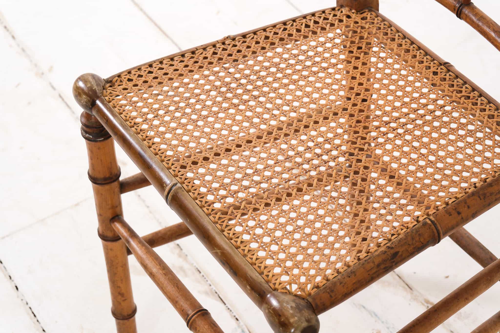 A pair of bamboo and cane chairs